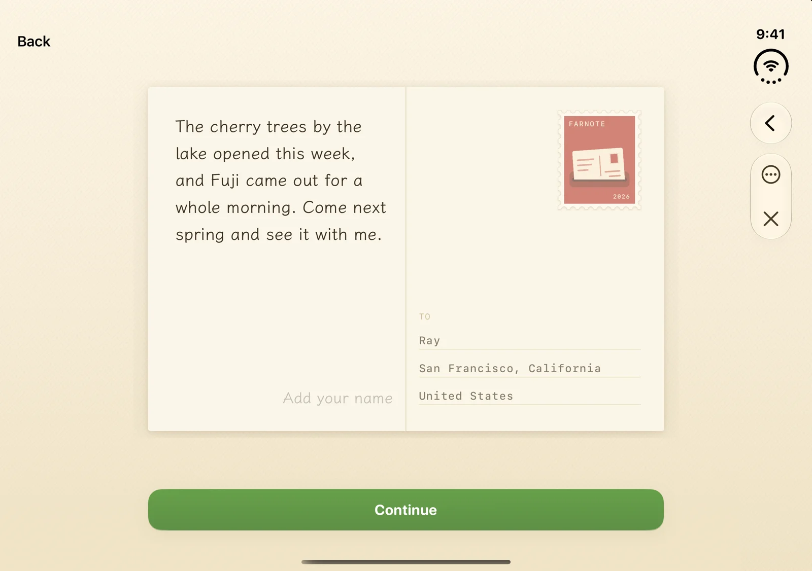 The back of a postcard on the unfolded iPhone Duo: the message on the left of the fold, the stamp and the friend’s name and city on the right.